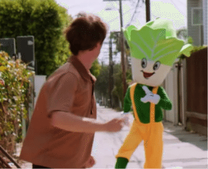 Cabbage mascot chasing main character in Verisign branding attempt